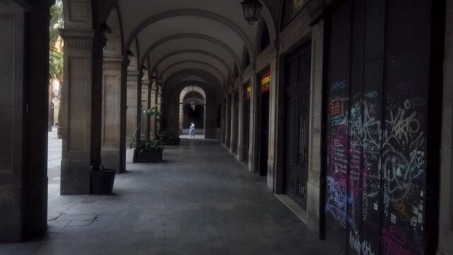 COVID-19. Lonely passageway in the Royal square of Barcelona during the social distancing period.