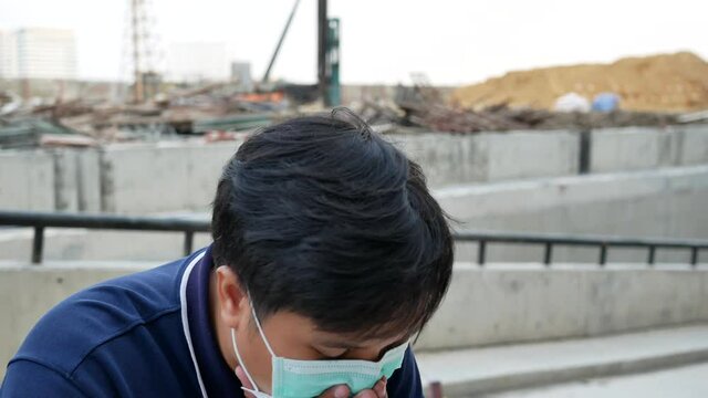 portrait of asian man wear a face prevent for protect disease virus and coughing.