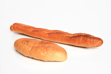 New long bread hot from oven on white table