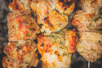 BBQ barbecuing skewers pork kebab, close up image.