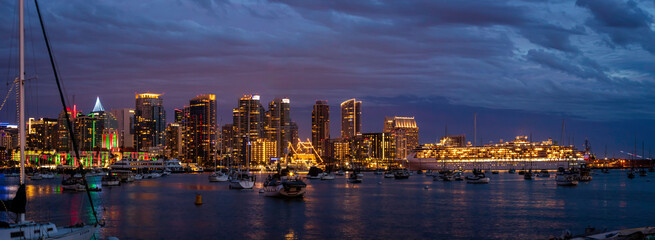 Sunset and night view of San Diego downtown with Christmas lights