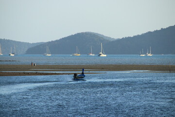 Long tail boat of fishermen on the sea