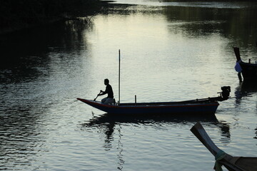 Long tail boat of fishermen on the sea