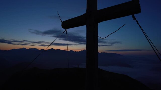 Rosskopf summit cross during blue hour in South Tyrol
