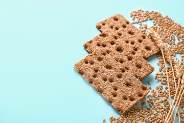 Rye crispbreads on color background