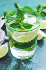 Glass of fresh mojito on table