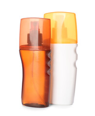 Bottles of sunscreen on white background
