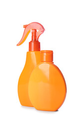Bottles of sunscreen on white background