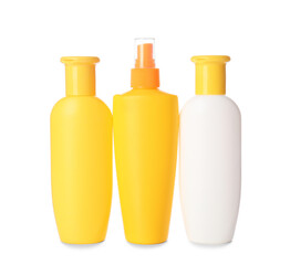 Bottles of sunscreen on white background