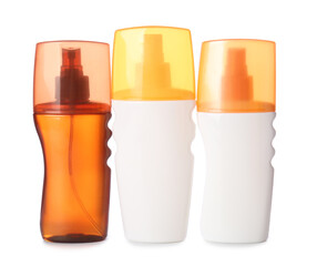 Bottles of sunscreen on white background