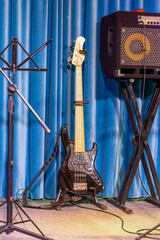 Electric guitar and stage amplifier closeup