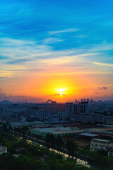 Fototapeta premium golden hour of sunrise with beautiful clouds in a small town