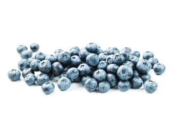 Tasty blueberries fruit are scattered on a white background.
