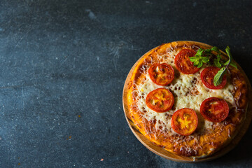 Cheese and tomato pizza isolated on a background.