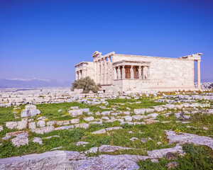 Acropolis of Athens Greece, Caryatids female statues on Erechtheion ancient temple under sunny blue sky