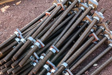 View of the carbon steel anchor bolts, nuts and washer for structure steel building in the construction field. © Funtay