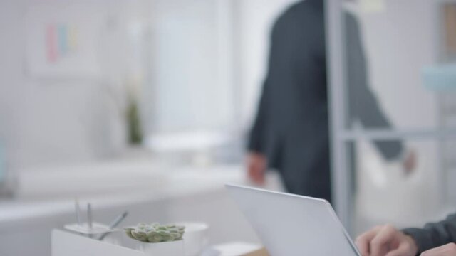 Unrecognizable male business people shaking hands after making agreement, horizontal close-up  shot footage