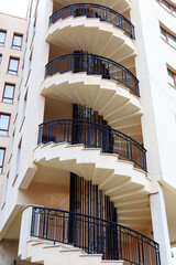 Spiral staircase on the outside facade of the house