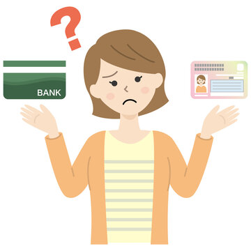 マイナンバーカードと銀行通帳を持つ疑問の若い女性