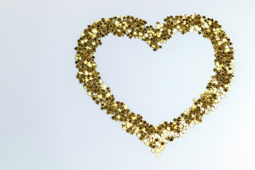 Heart made of golden stars. Copy space - concept of love, romance, family, gift