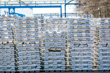 Aluminium ingots in outside field of factory. The Hall–Heroult process is the major industrial...