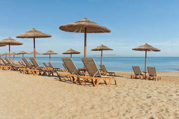 Parasols and sun loungers on the beach