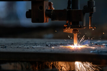 CNC Plasma cutting. It is a process that cuts through electrically conductive materials by means of an accelerated jet of hot plasma. - obrazy, fototapety, plakaty