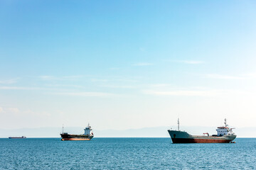 Cargo ship or bulk carrier moored in the gulf. A bulk carrier, bulk freighter or colloquially, bulker is a merchant ship specially designed to transport unpackaged bulk cargo.
