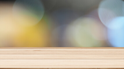 Image of wooden board table in front of blurred bokeh background.