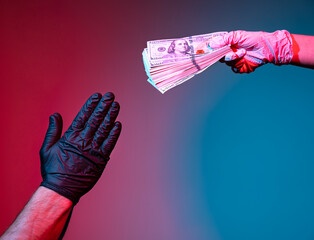 Man in protective gloves begging dollars from a woman