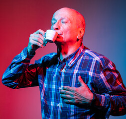 Senior man enjoying  a cup of coffee