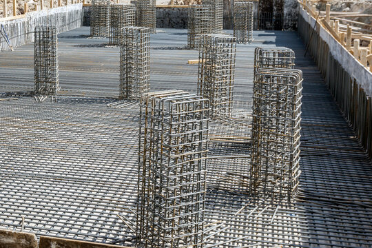 A tied rebar beam cage before casting concrete. This will be embedded inside cast concrete to increase its tensile strength. Rebar, known when massed as reinforcing steel or reinforcement steel.