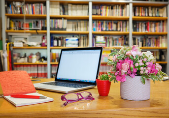 Work from home safely and peacefully in the quarantine period..On the desk, a vase of flowers,...