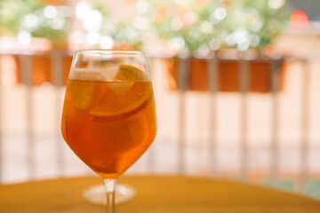 Summer citrus cold alcohol drink Aperol Spritz, closeup, copyspace.