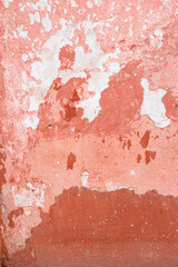 pink texture of an old wall. vintage background of dirty rough plaster