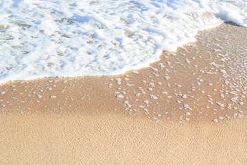wave of blue ocean on sandy beach. Background.