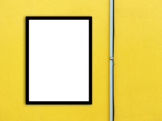 Photo frame mockup with pipe on yellow wall