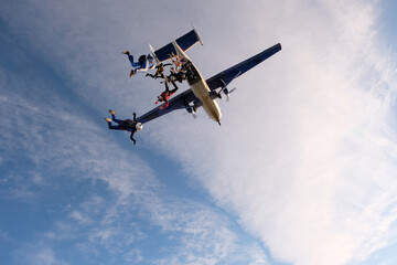 Fototapeta na wymiar SKydiving. Skydivers start to jump. First seconds.