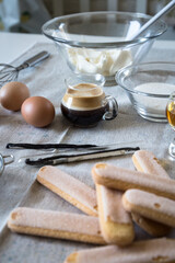 Ingredients for homemade tiramisu: mascarpone cheese, eggs, coffee, cognac, vanilla, sugar, cocoa powder and ladyfingers. 