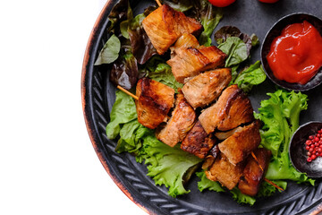 Skewers of Meat with sauce .  Grilled Meat isolated over White.