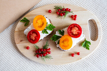 sandwiches with tomato herbs and berries