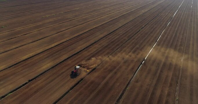 Peat harvesting in bog peat production fields aerial view