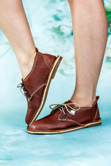 Naklejka premium Ladies brown leather vintage shoes isolated close-up