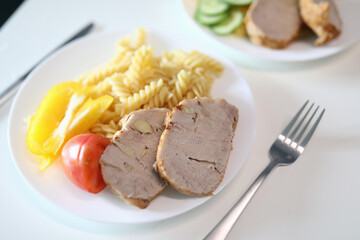 Plate of spaghetti with bacon and tomato. Online cooking school concept