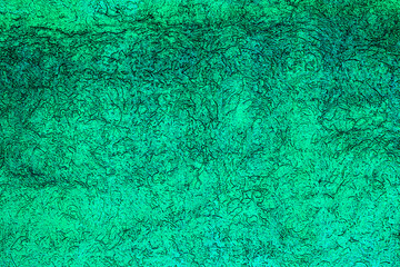 Aquamarine colored glass texture background with textures of different shades of aquamarine