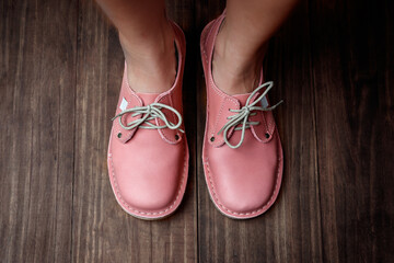 Pink ladies leather shoes isolated close-up