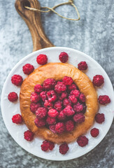 Homemade bun with berries close-up shot from above, light background, photo of a summer snack, berry flat lay