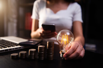 business hand showing creative business strategy with light bulb as concept
