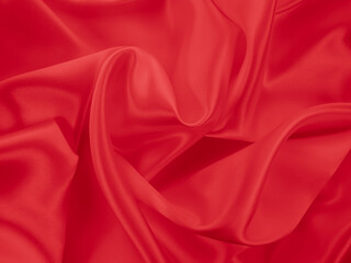 Beautiful elegant wavy hot red satin silk luxury cloth fabric texture, abstract background design. Wallpaper, banner or card with copy space.