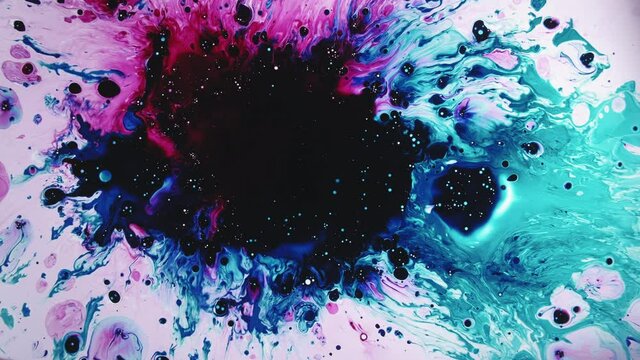 Color splatter. Fantasy universe. Blue pink paint mix flow with black bubble stain copy space on white.